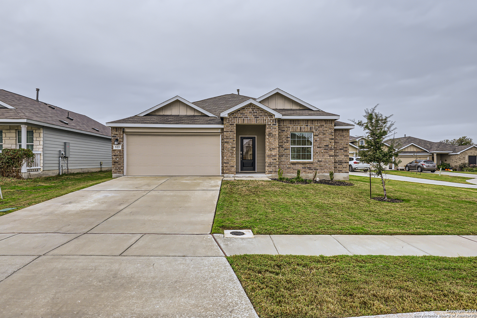 a front view of a house with a yard