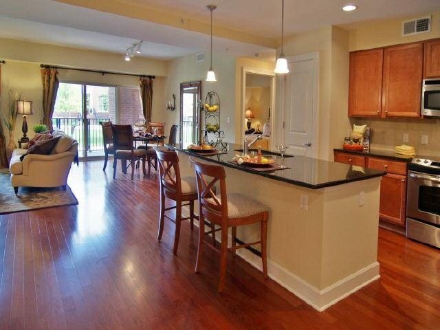 a dining table with chairs and wooden floor