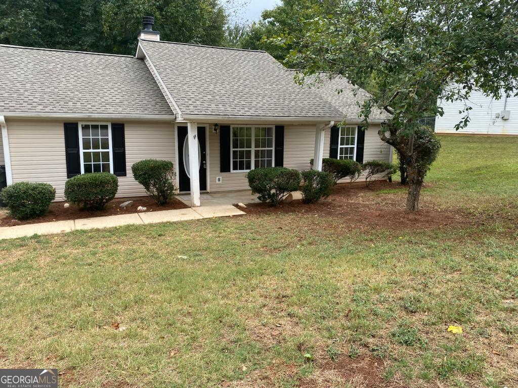 front view of a house with a patio