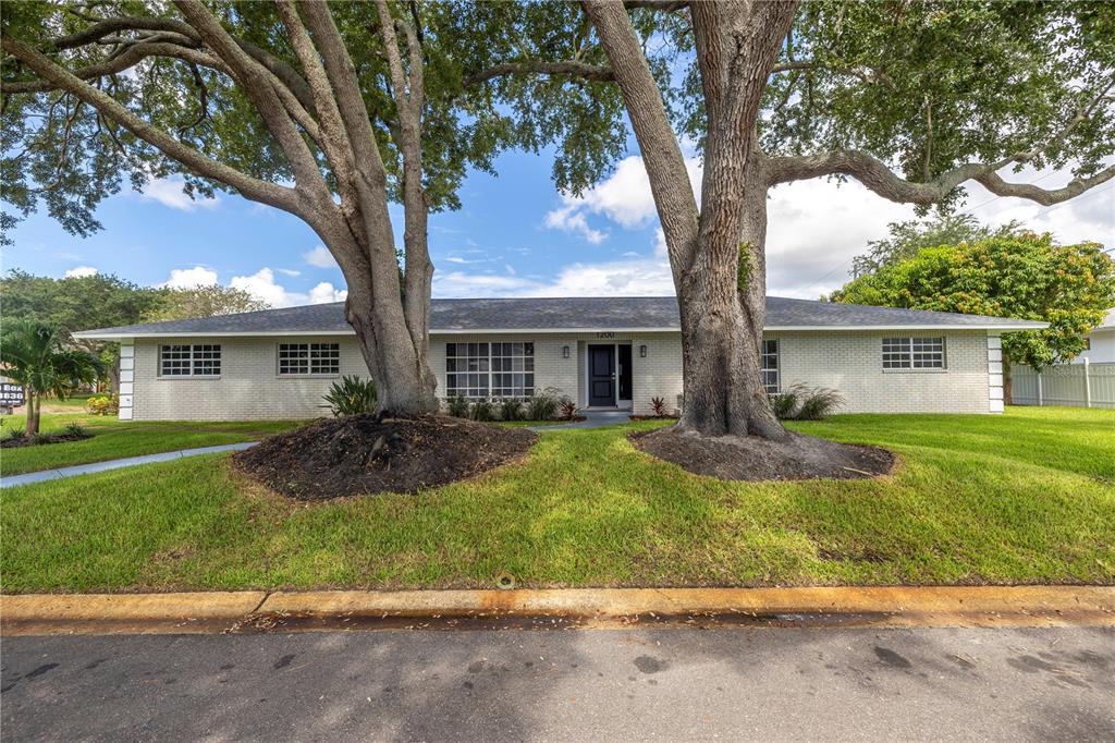 front view of a house with a yard