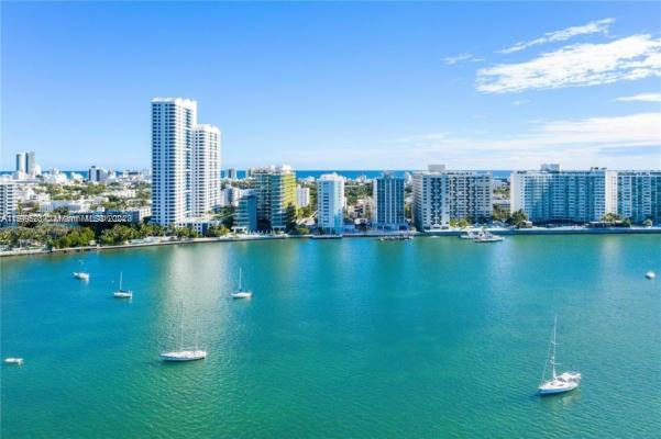 a view of a city with tall buildings and lake view