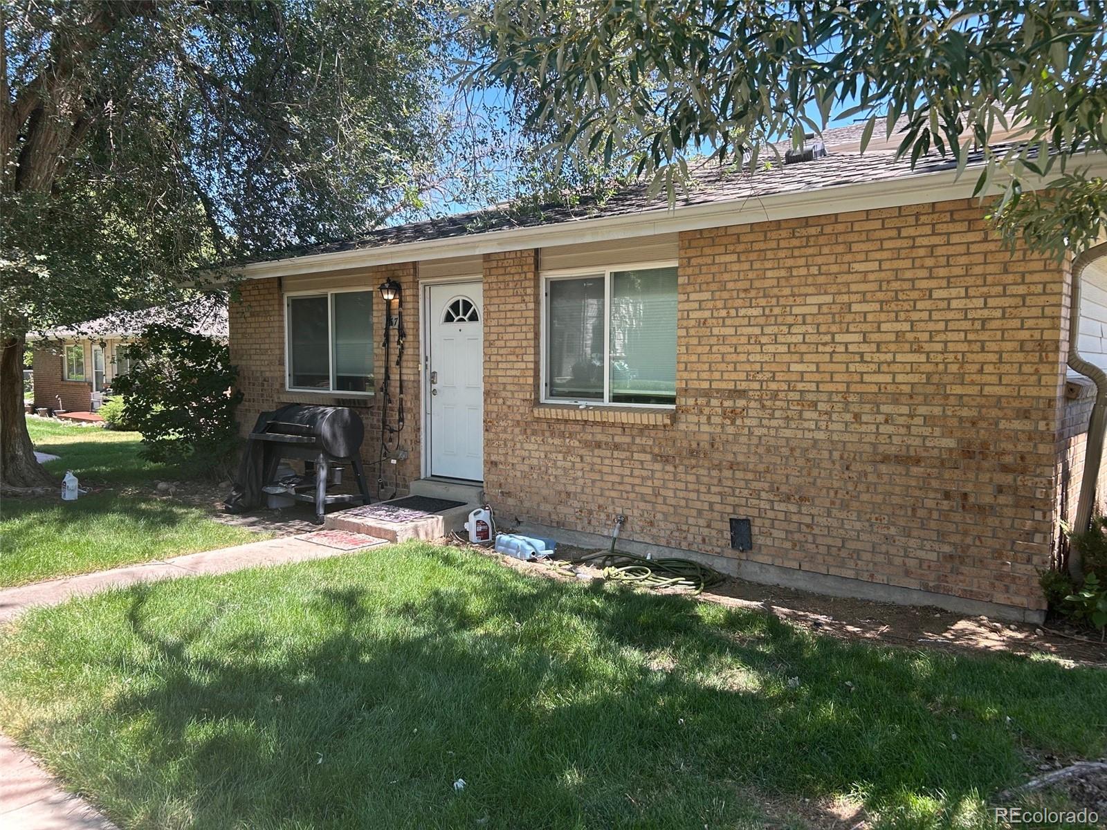 front view of a house with a yard