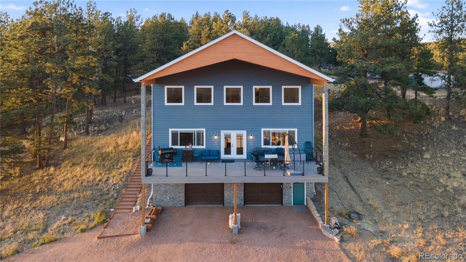 a front view of a house with garage