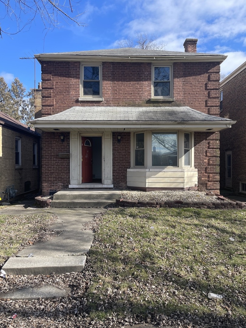 a front view of a house with garage