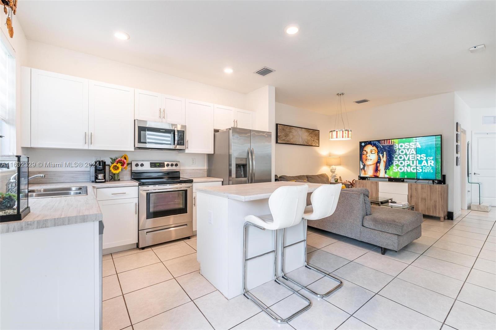 a living room with furniture and a flat screen tv