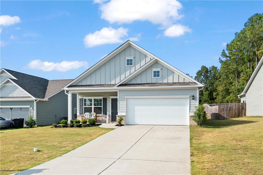 a front view of a house with garage