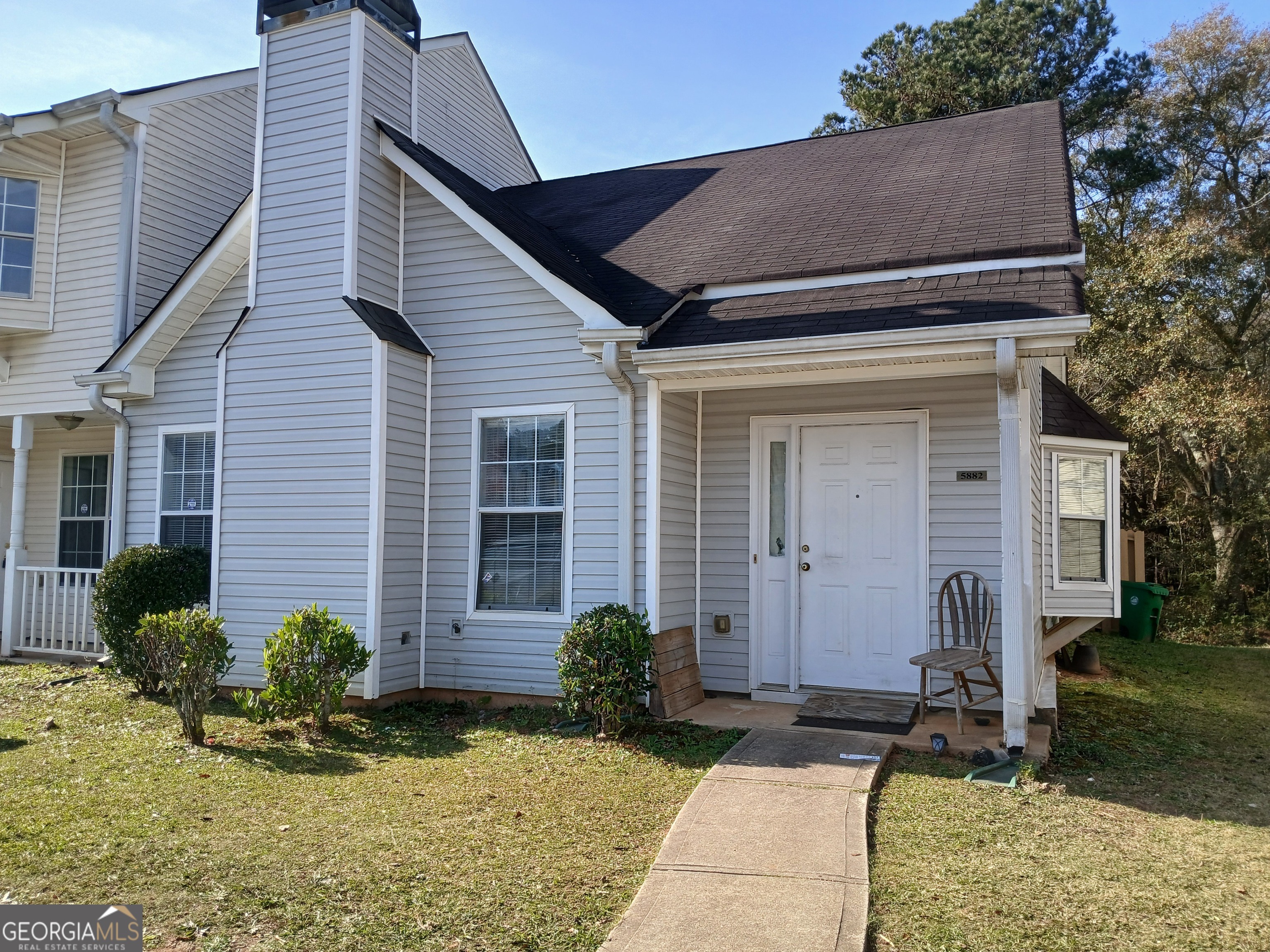 a front view of a house with garden