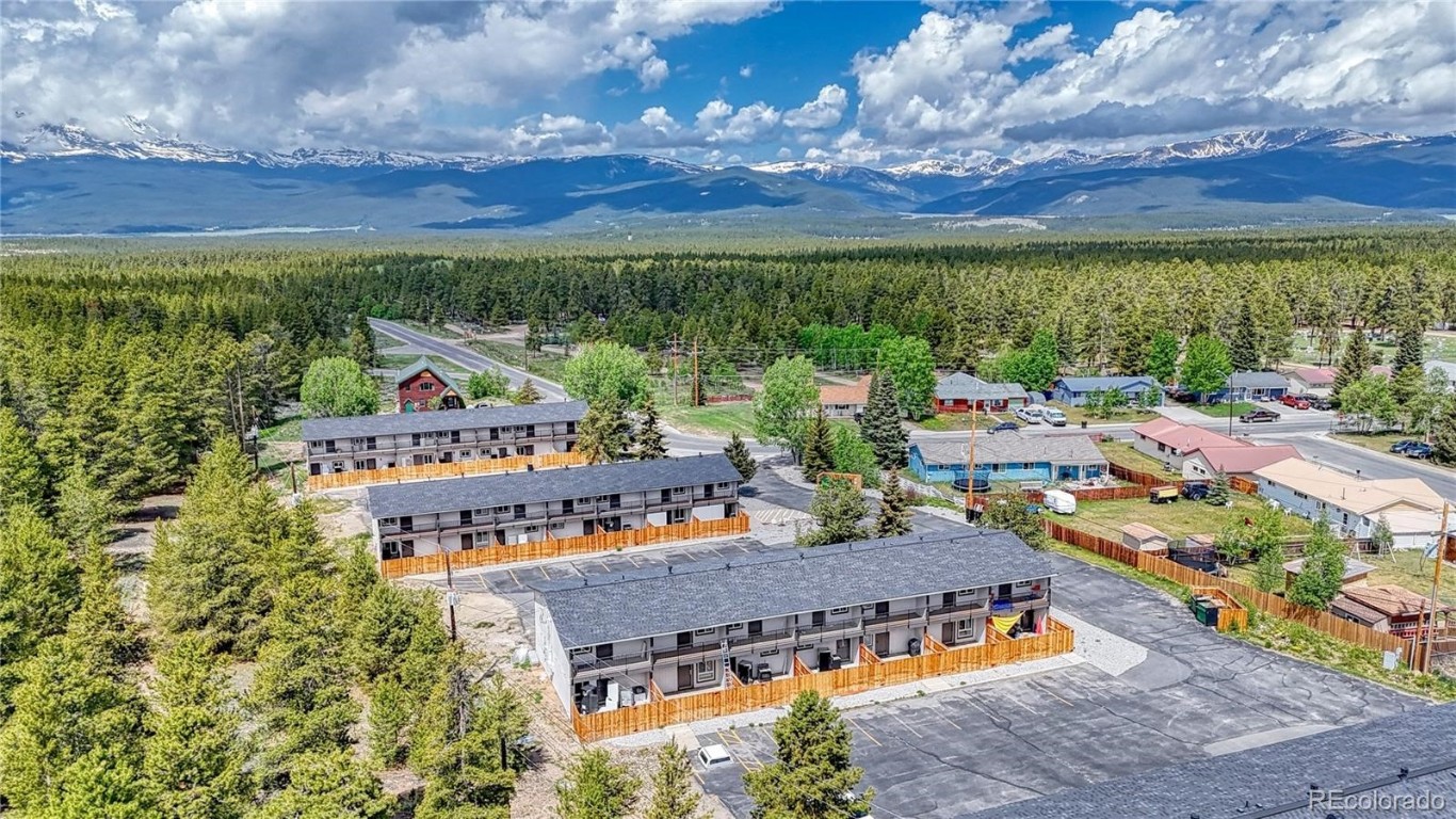 an aerial view of a house with balcony swimming pool and mountain view