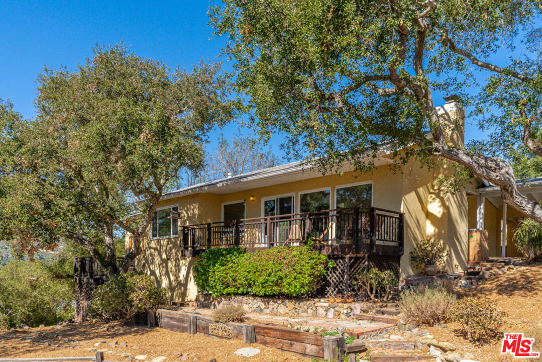 front view of house with a tree