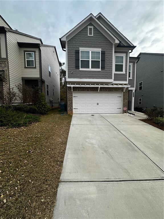 a front view of a house with garage