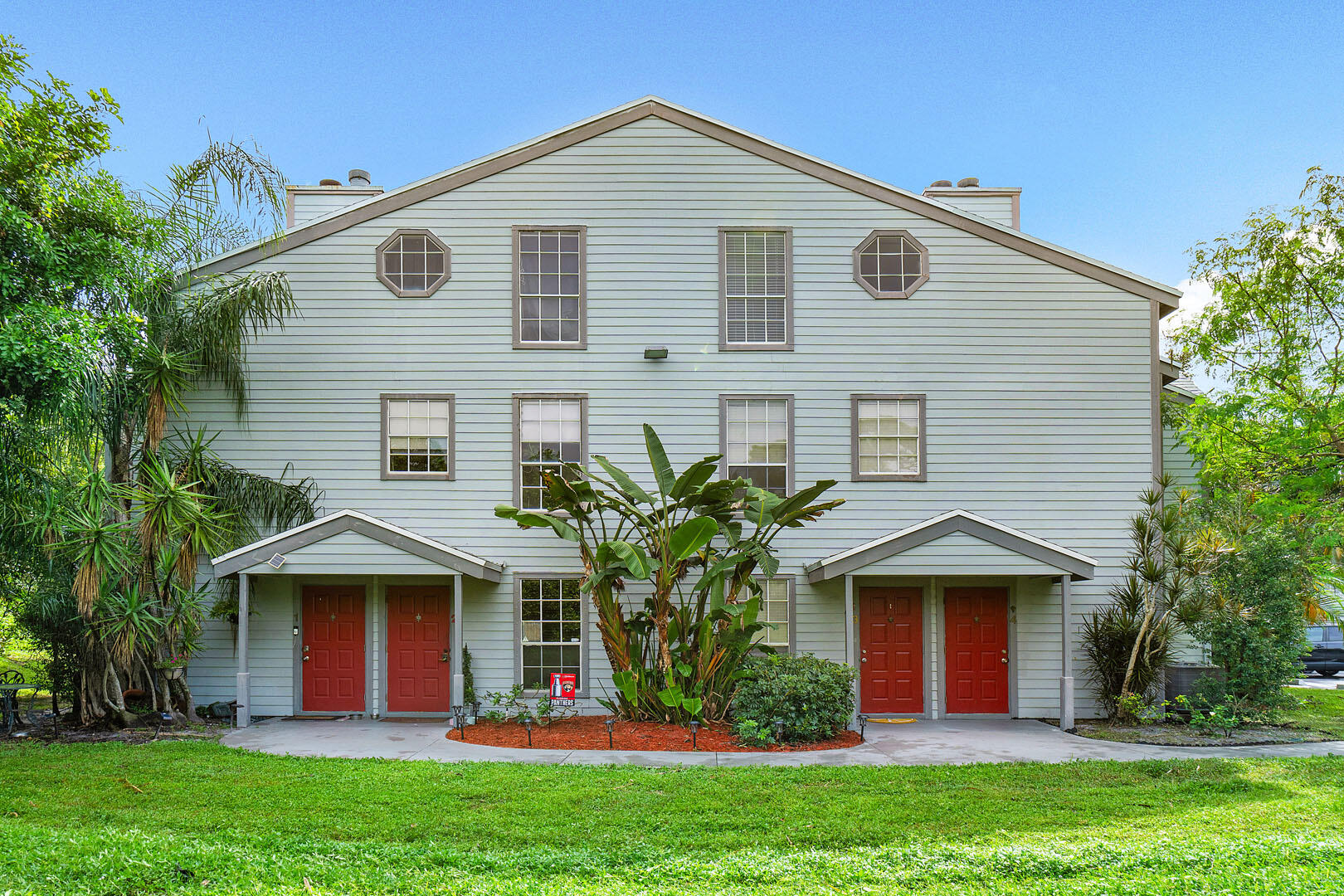 a front view of a house with garden