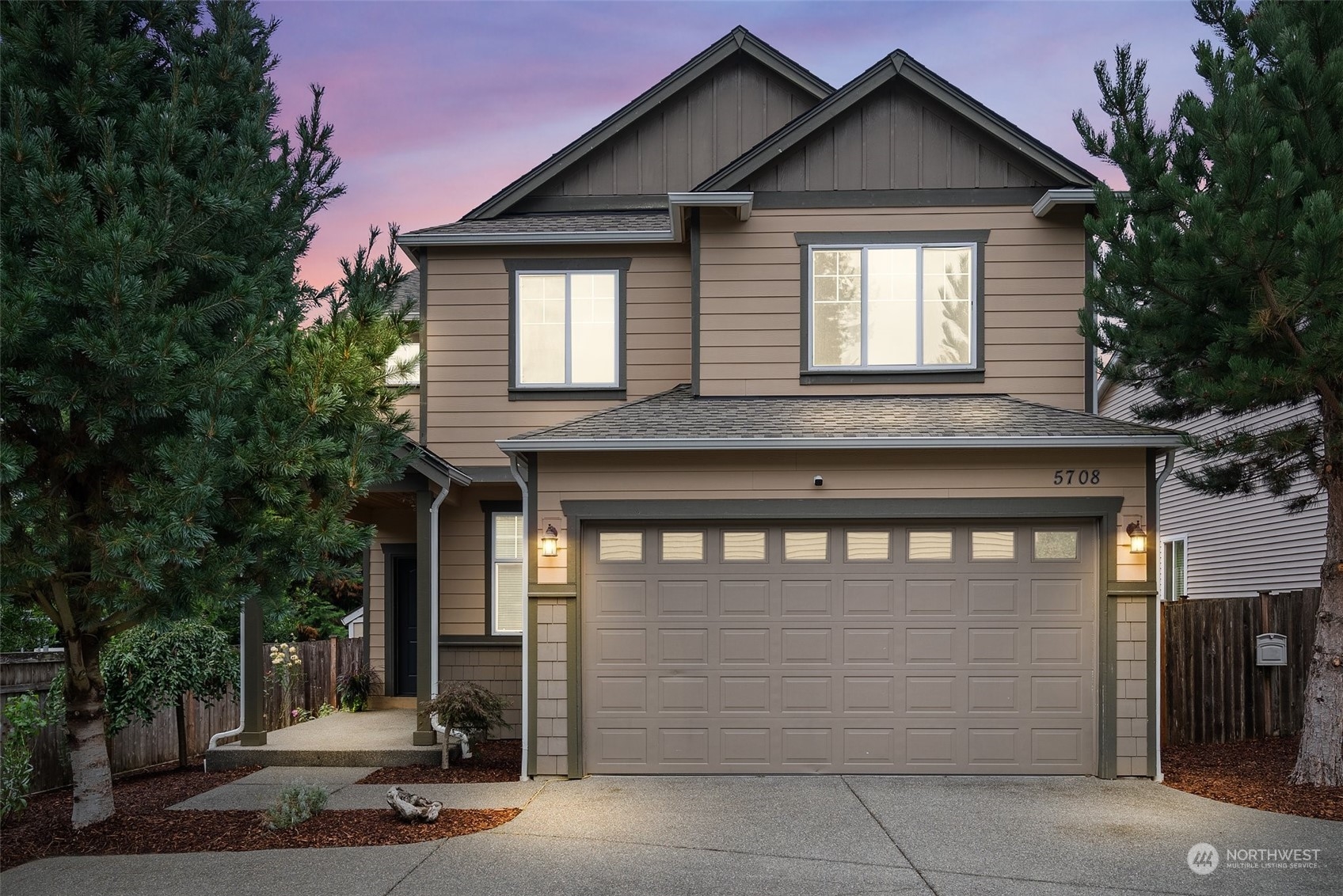 a front view of a house with a garage