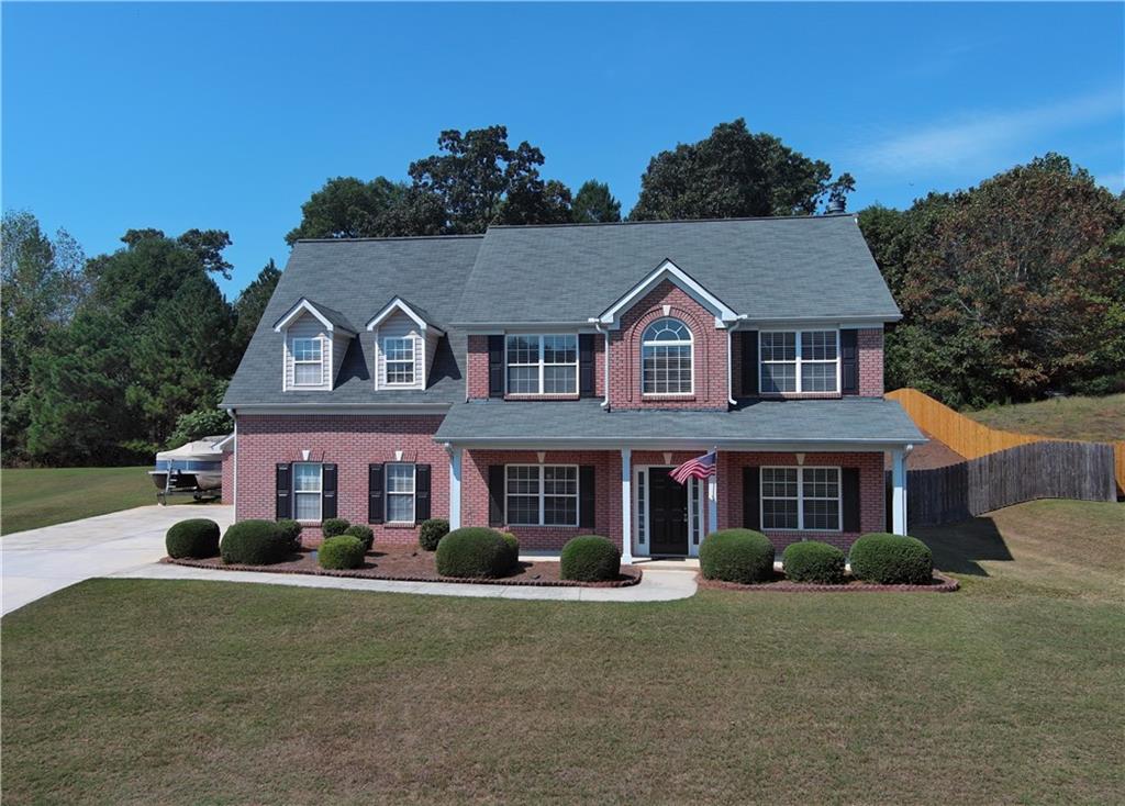 front view of a house with a yard