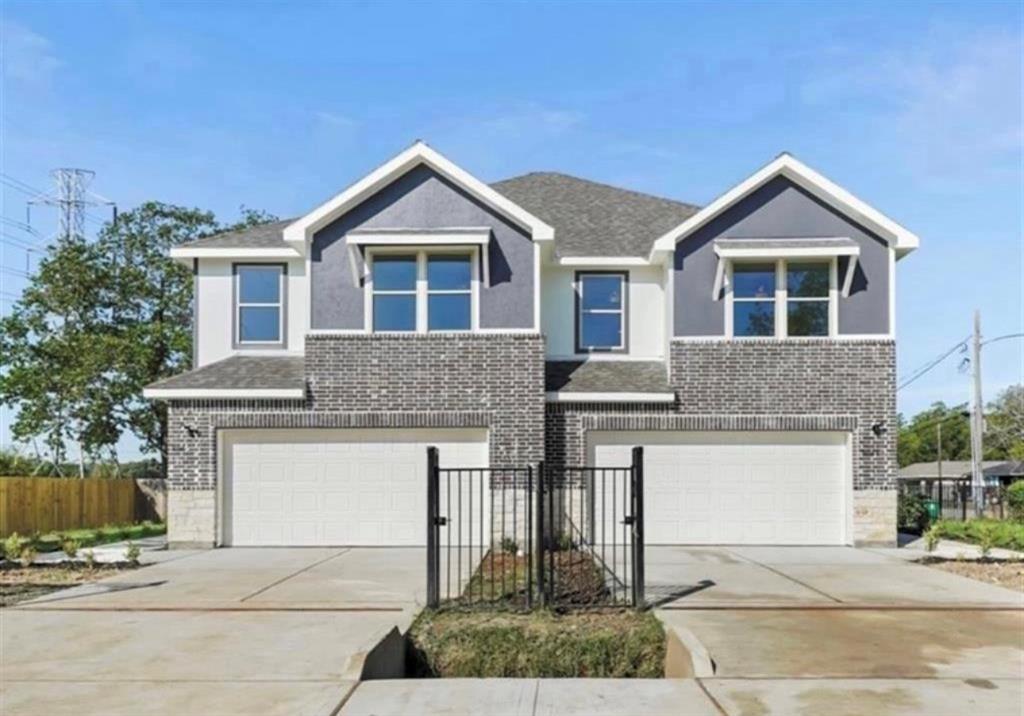 a front view of a house with garage