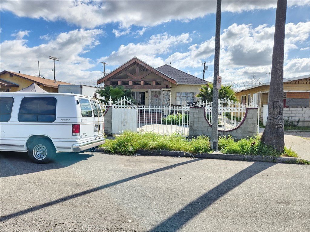 a front view of a house with a yard and table