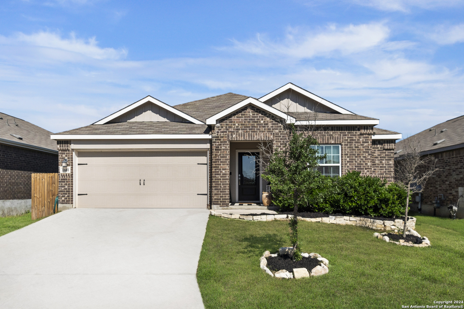 a front view of a house with a yard