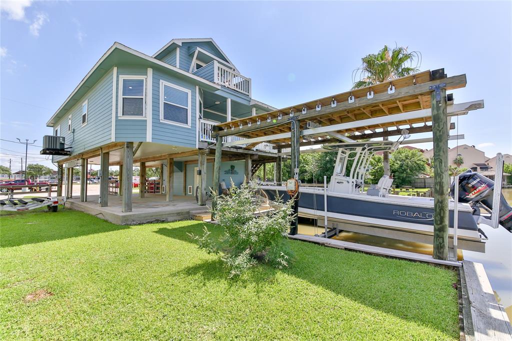 a view of a house with a yard porch and sitting area