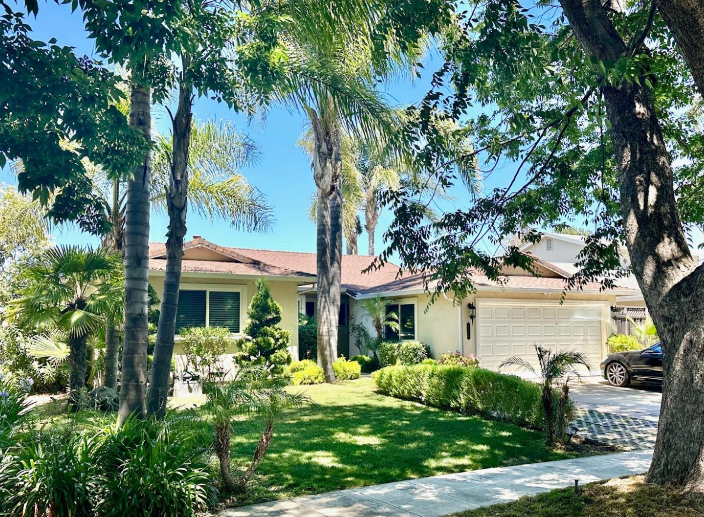 front view of a house with a garden