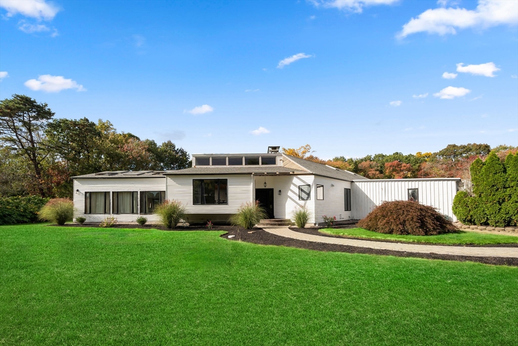 a house view with a garden space