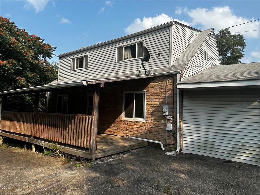 a front view of a house with garage