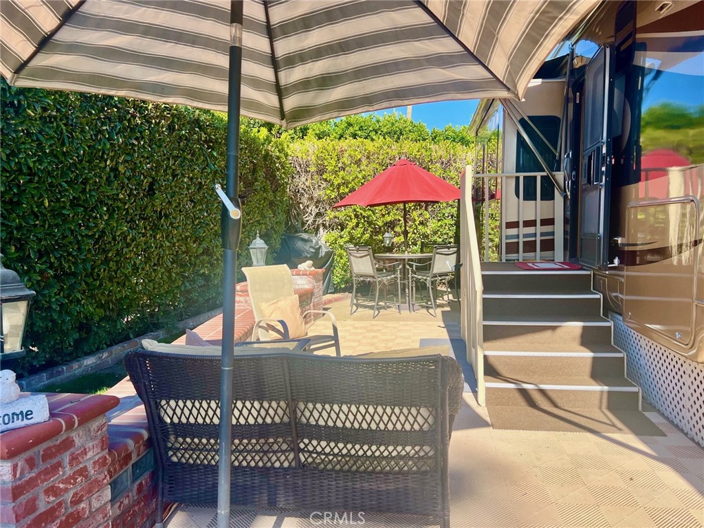 a view of a chairs and table in the patio