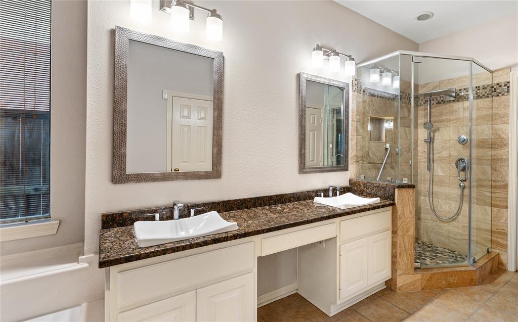 a bathroom with a granite countertop sink mirror and double