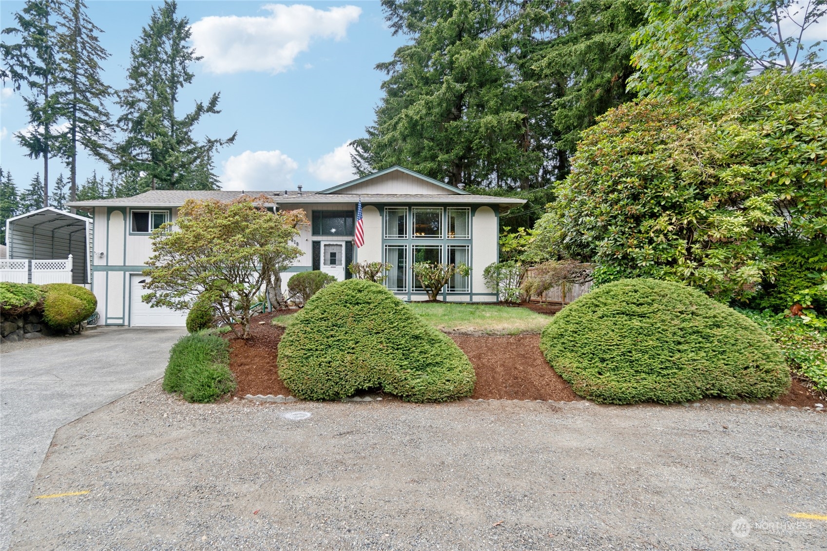 a front view of a house with garden