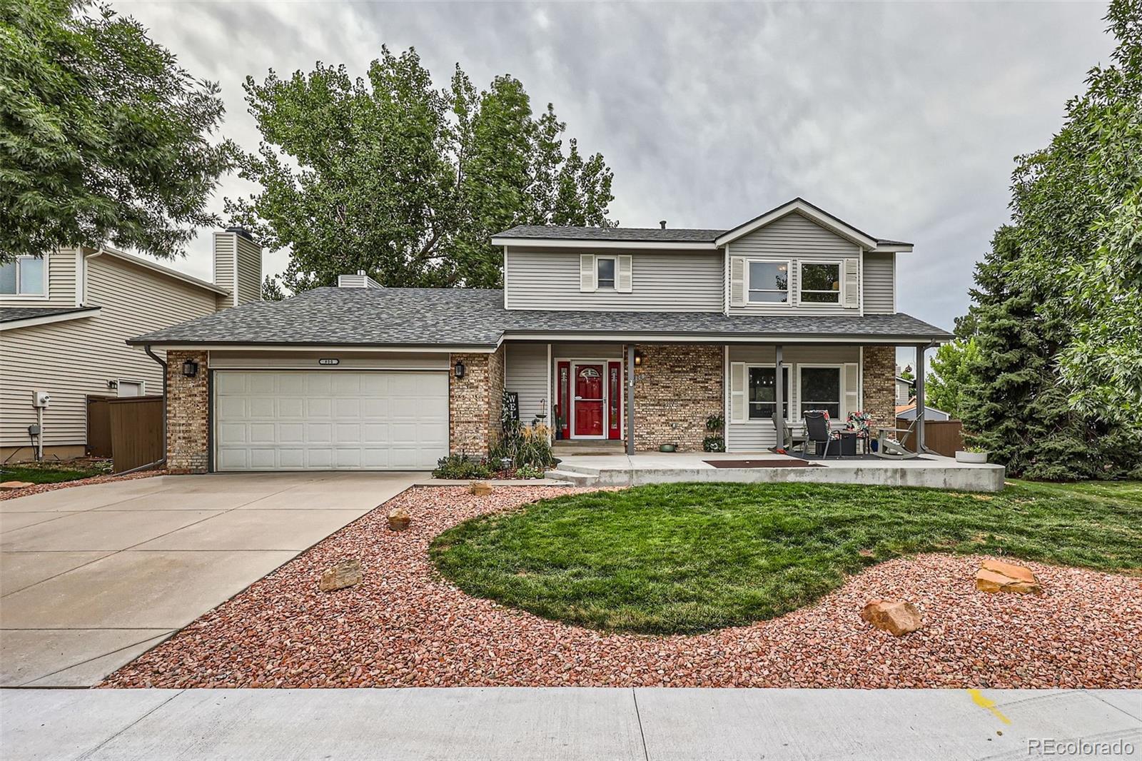 a front view of house with yard outdoor seating and barbeque oven