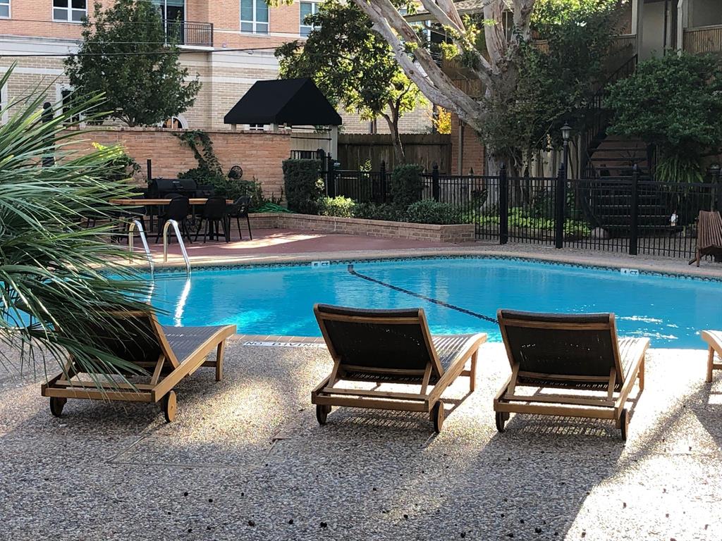 a view of a backyard with sitting area