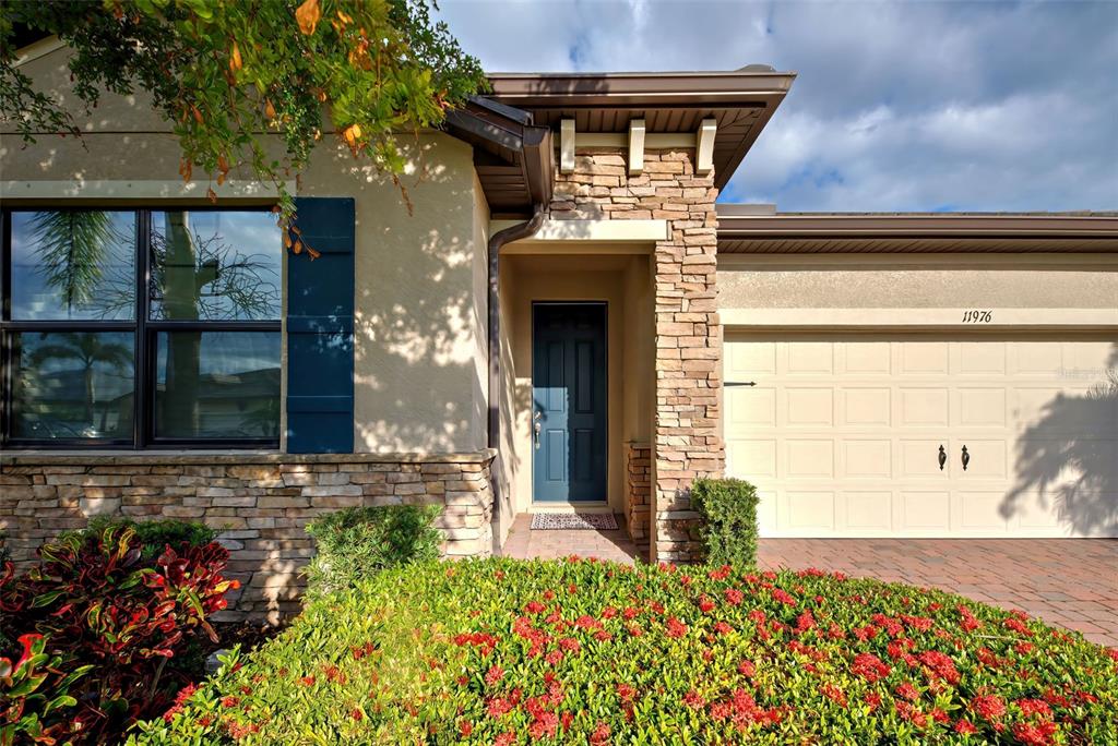 front view of a house with a small yard