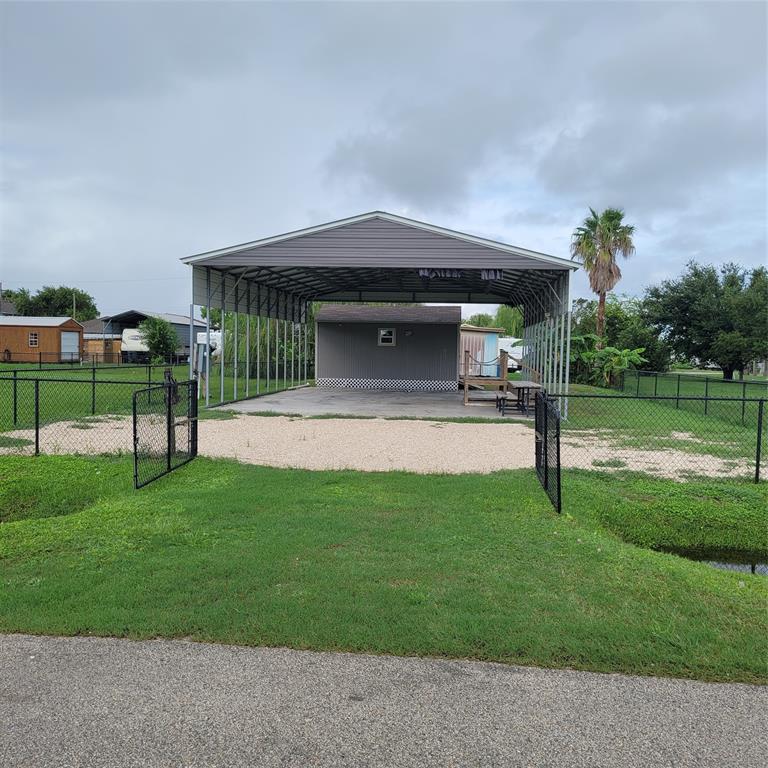 a view of a house with a yard porch and sitting area