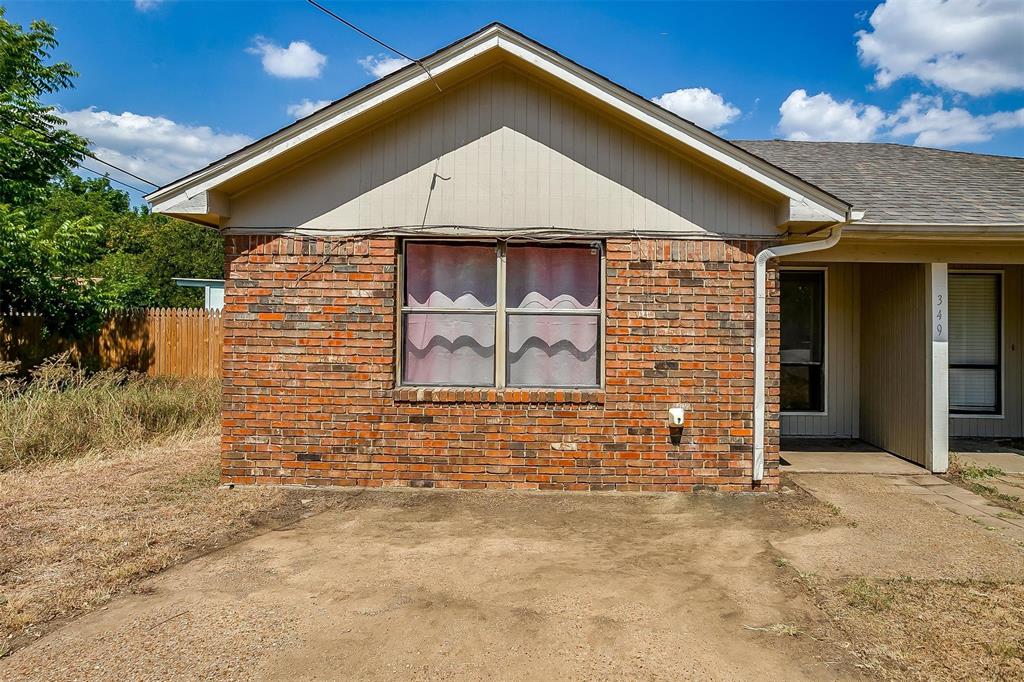 a front view of a house with garage