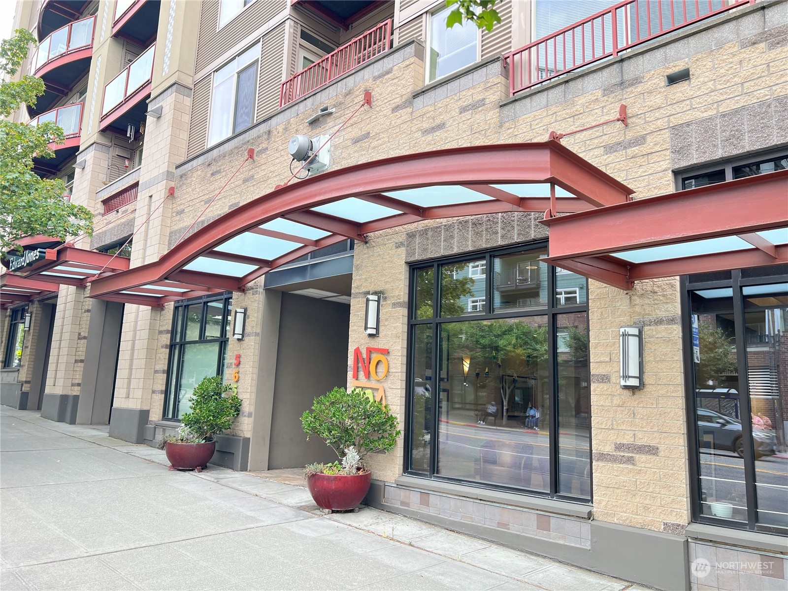 a view of a building with potted plants