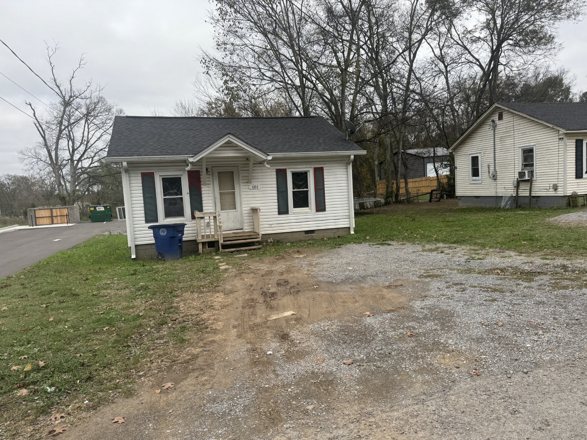 a front view of house with yard and trees