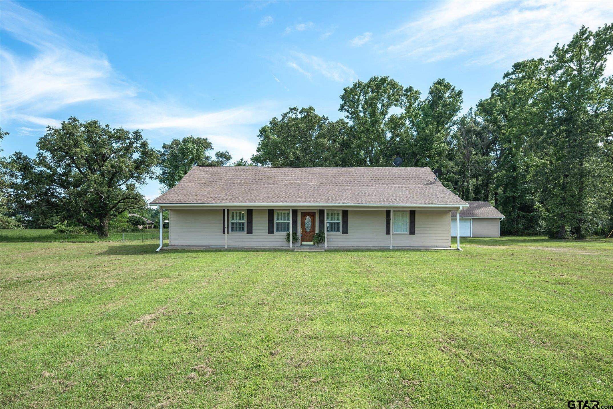 a view of a house with a big yard