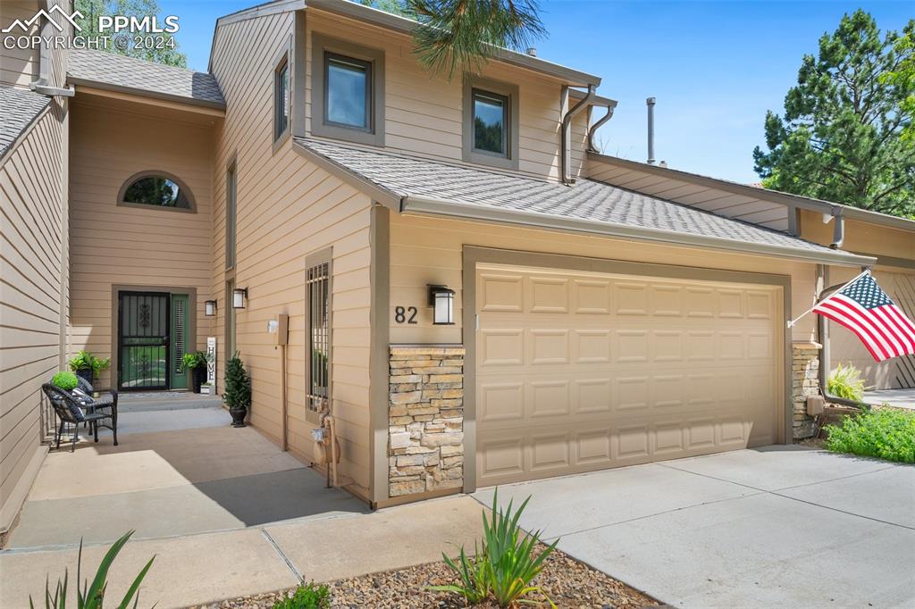 a front view of a house with a garage