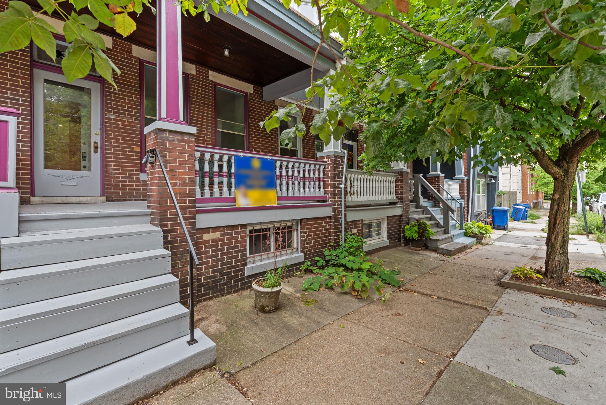 a front view of a house with a small yard