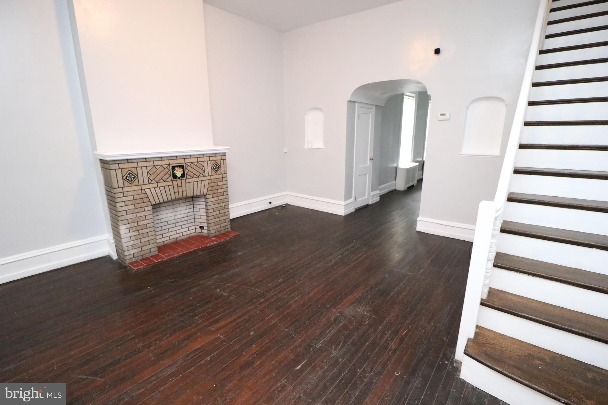 a view of entryway with wooden floor