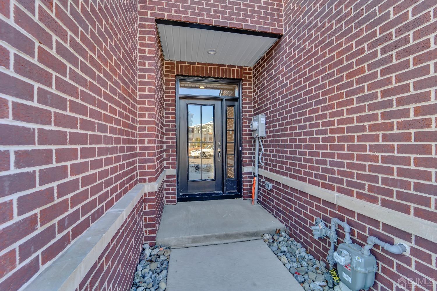 a view of a brick house with many windows