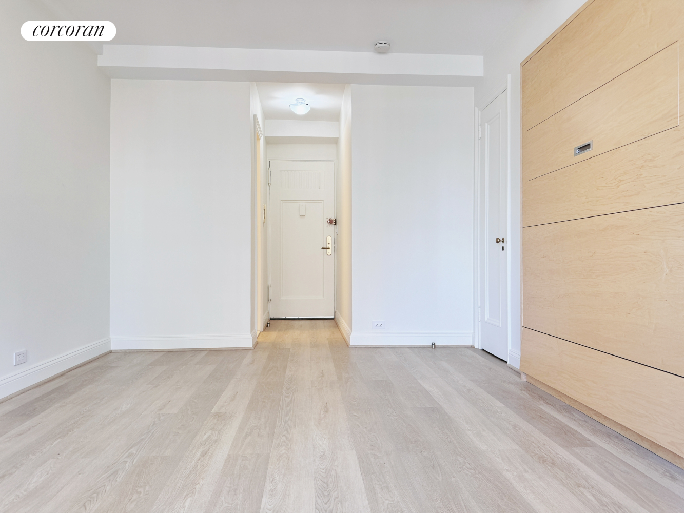 an empty room with wooden floor