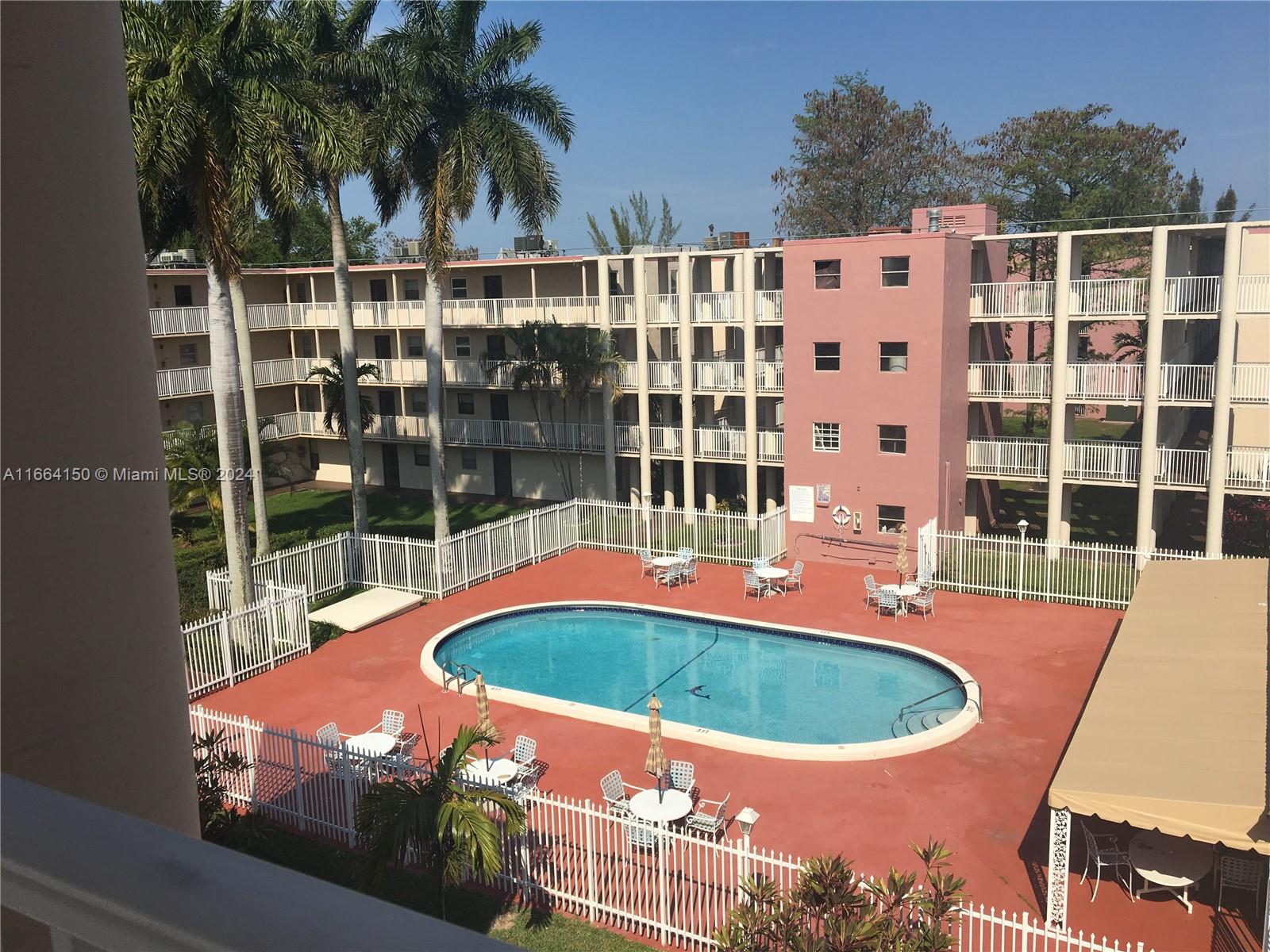 a view of a swimming pool with a patio