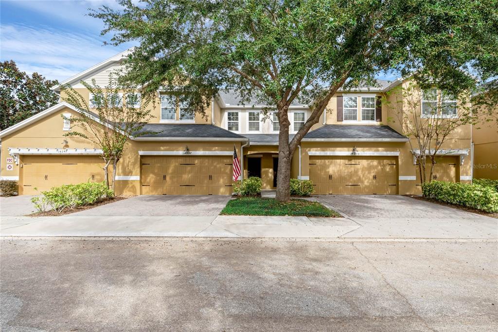 front view of a house next to a yard