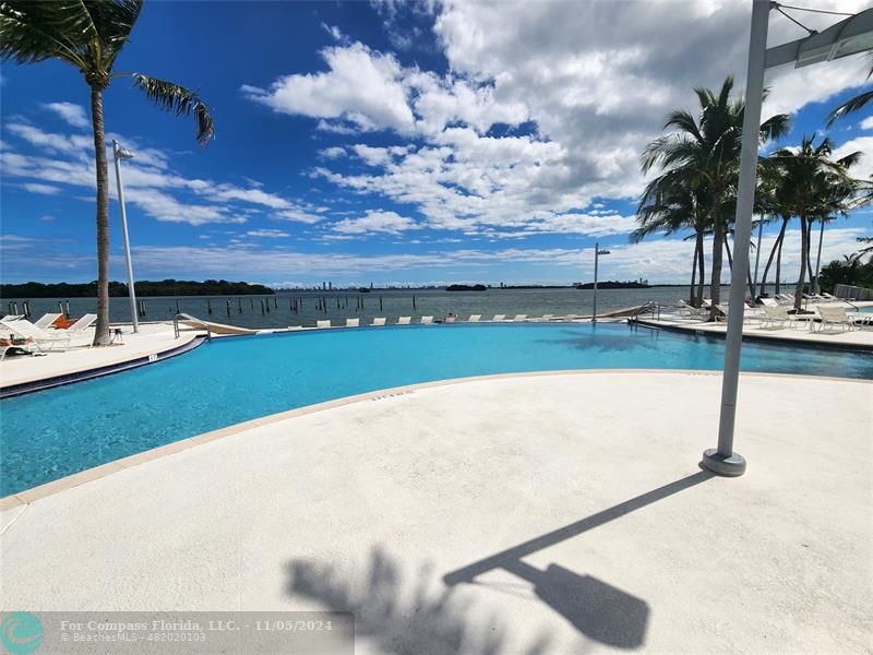 a view of a swimming pool and an outdoor space