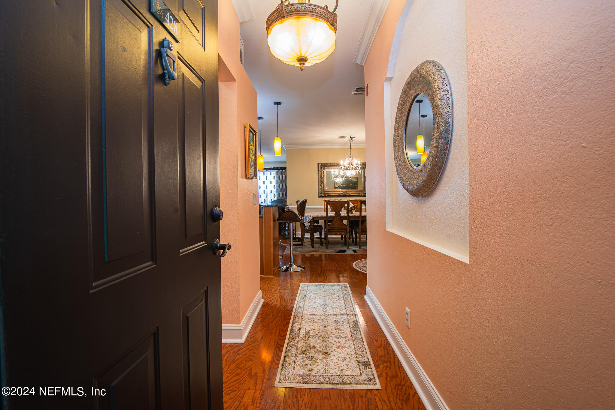 view of a hallway with wooden floor