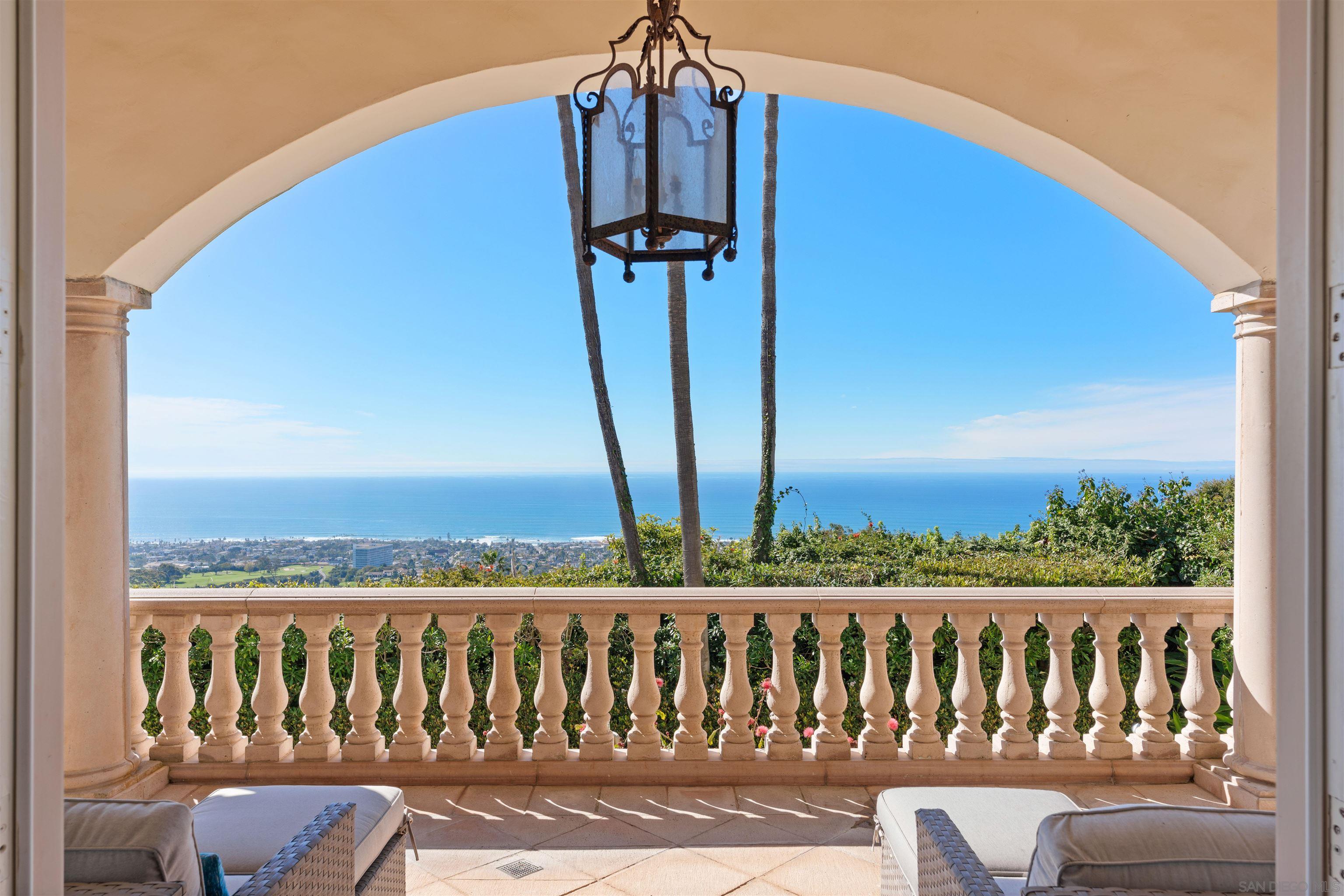 a view of a balcony with wooden floor