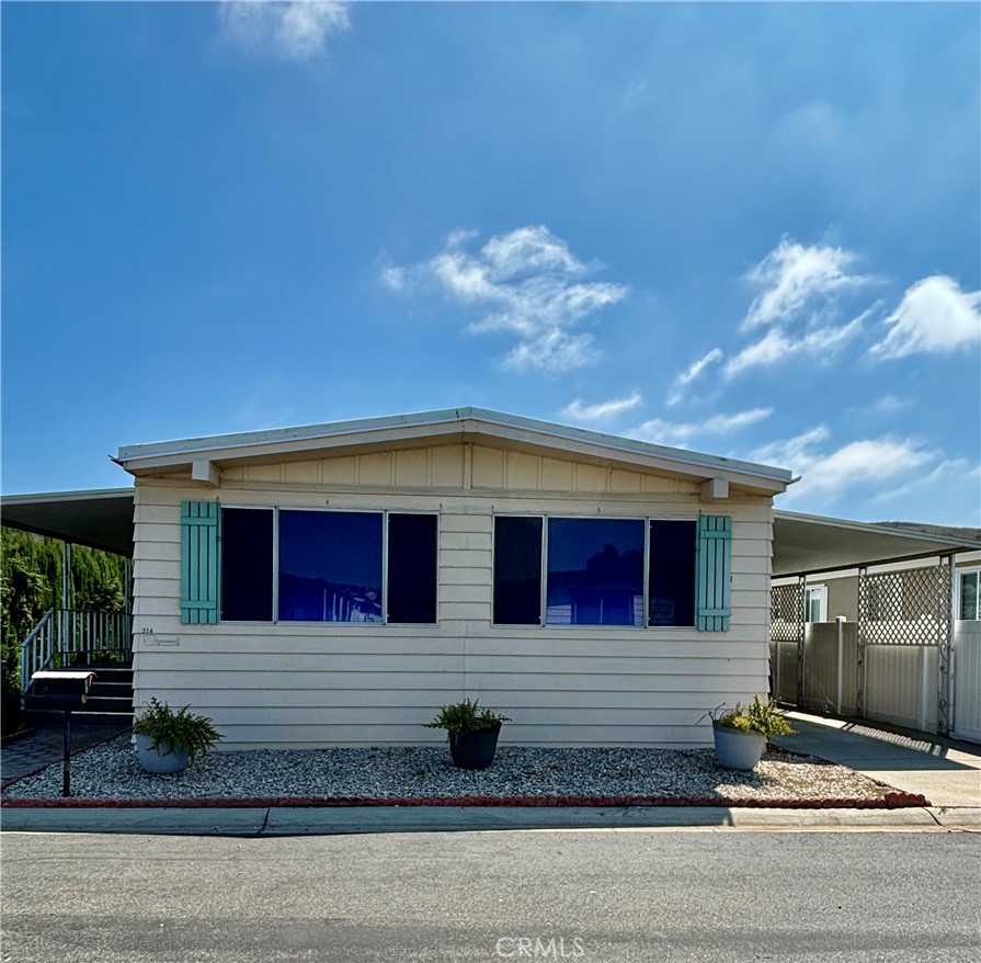 a front view of a house with yard