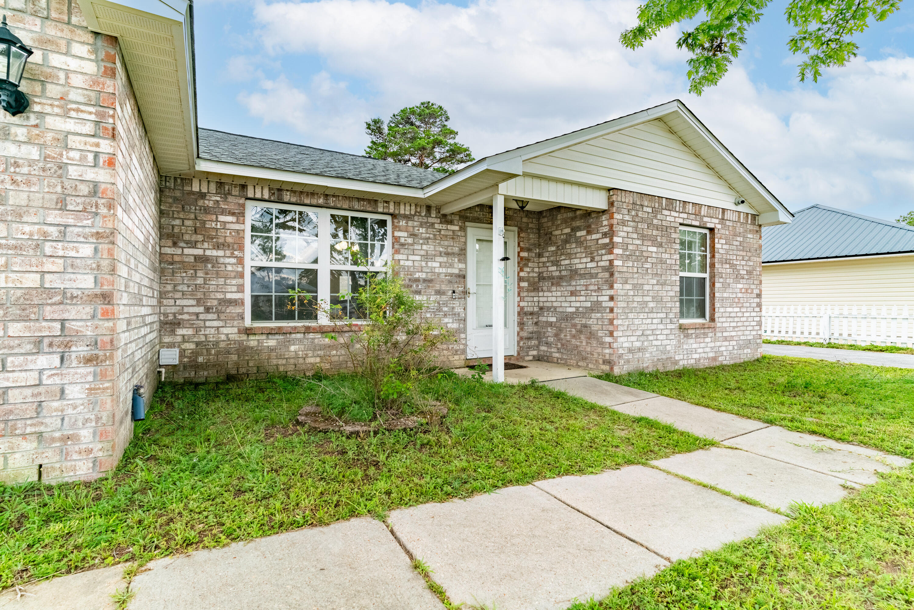 front view of a house with a yard