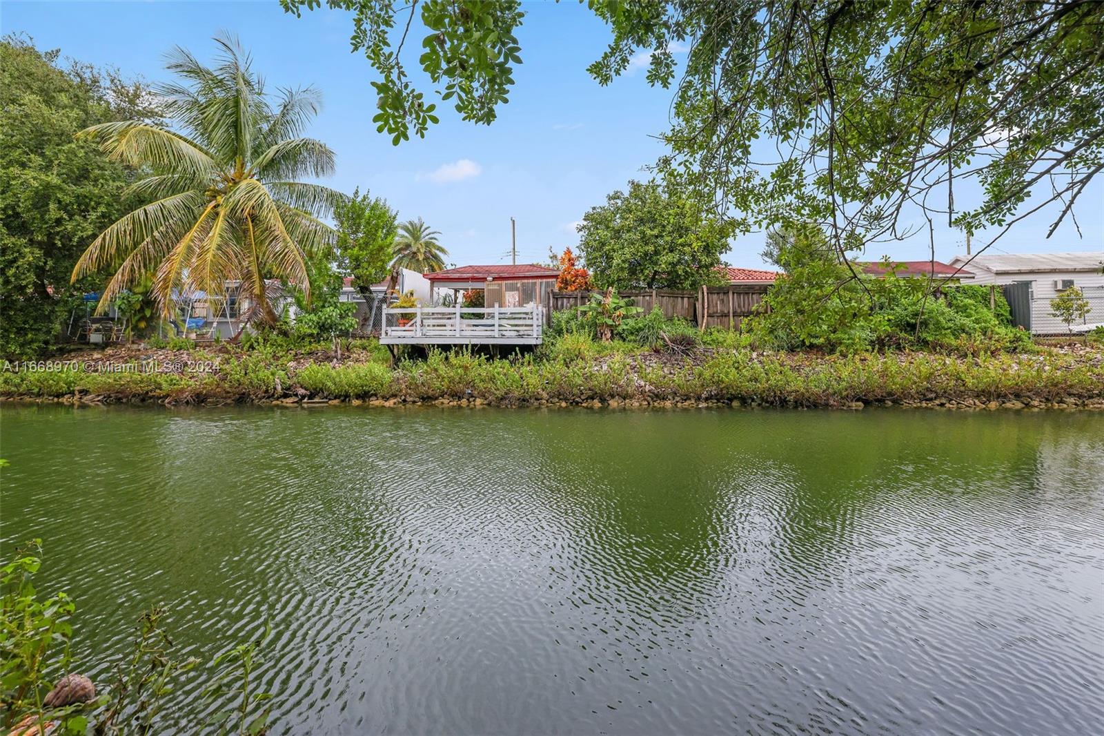 a view of a lake with a building in the background