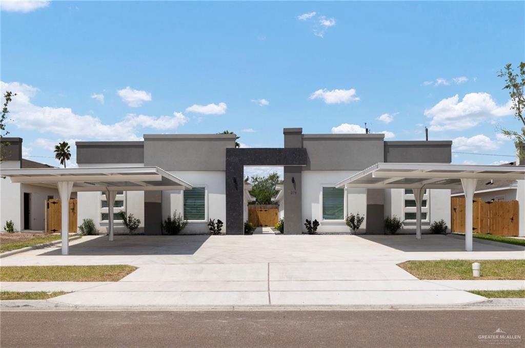 View of front of property with a carport