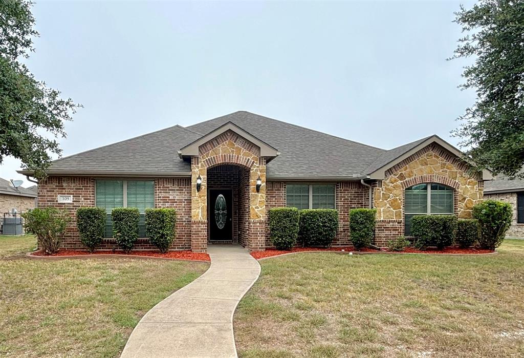 front view of a house with a yard